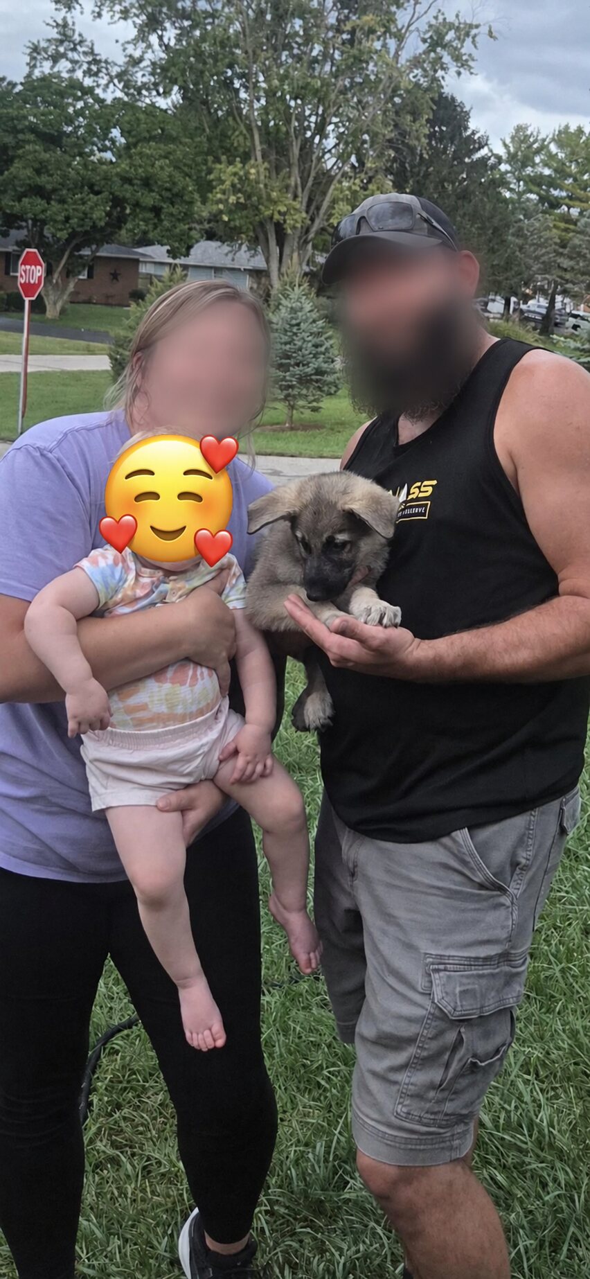 Ben with their family; family members' faces are blurred for privacy