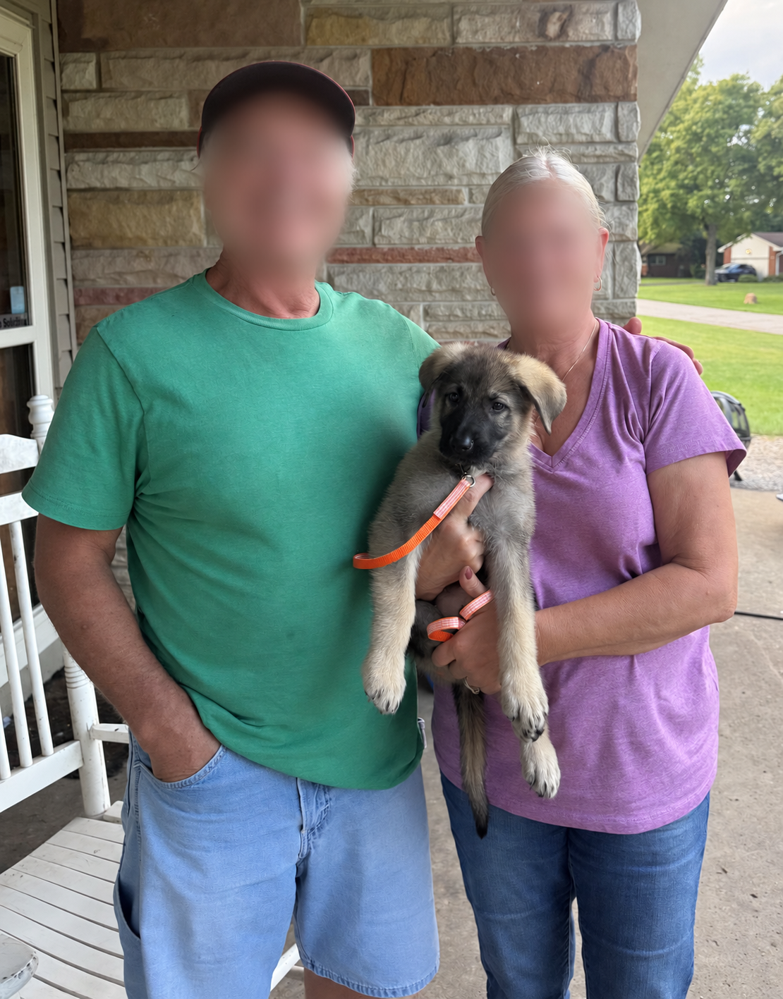Miles with their family; family members' faces are blurred for privacy